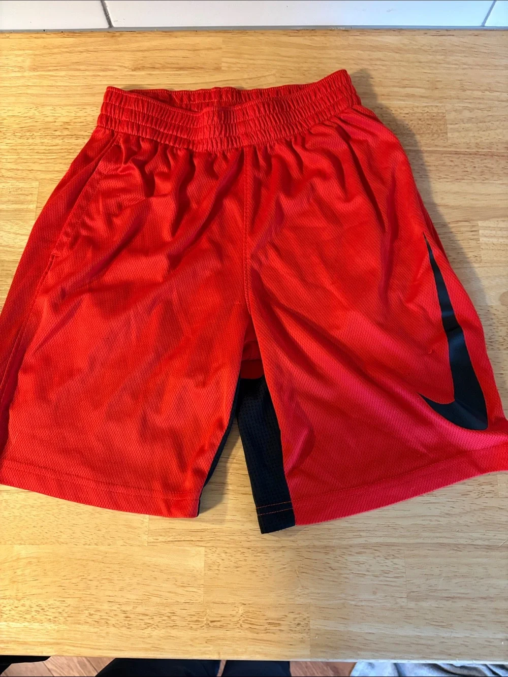 Nike Red Mesh Sports Shorts with Black Swoosh